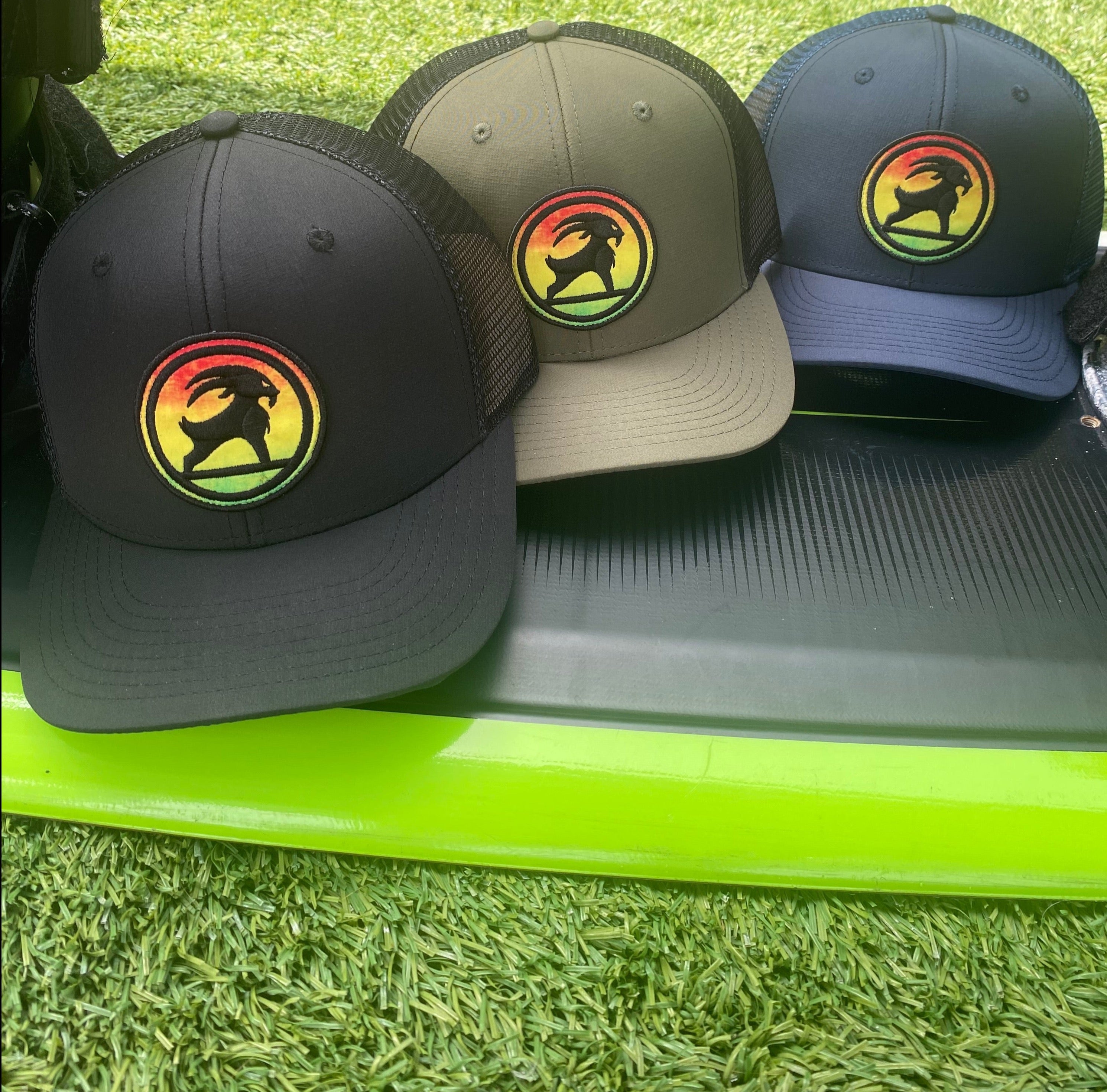 SURFGOAT “KING” -SPF 50 UV TRUCKER Hat (Rasta/Mixed)